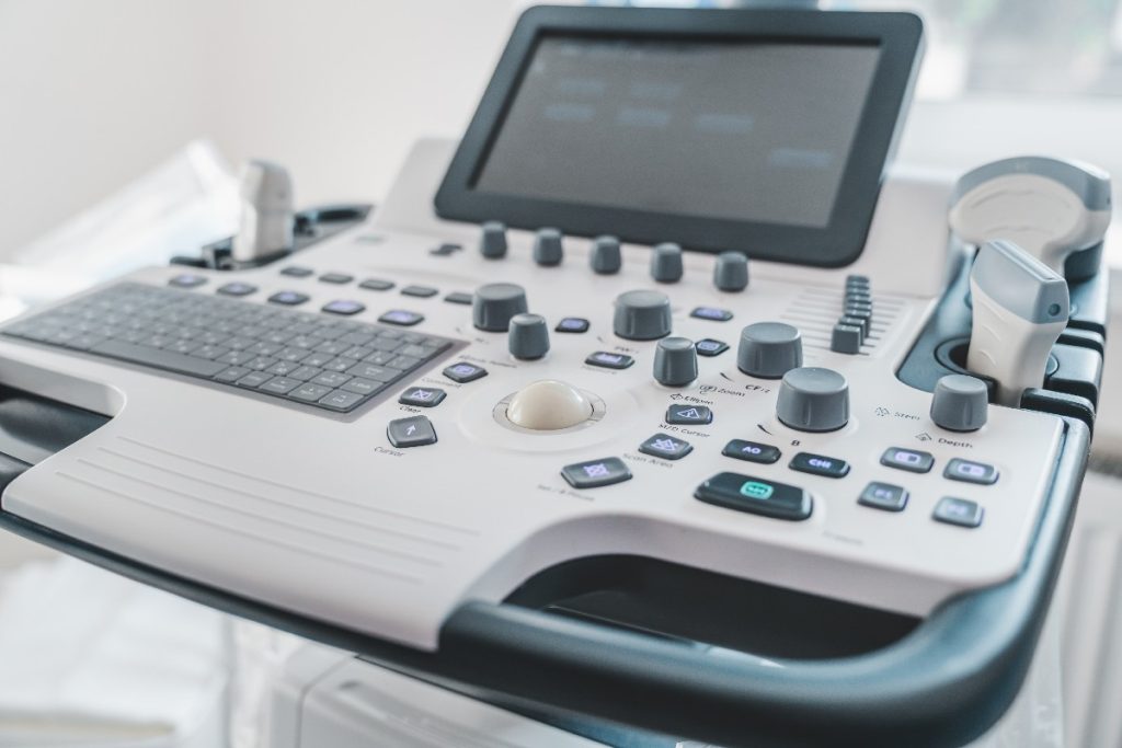 Close Up Of Ultrasound Machine In Clinic. Health Care, Diagnostic And Disease Prevention Concept